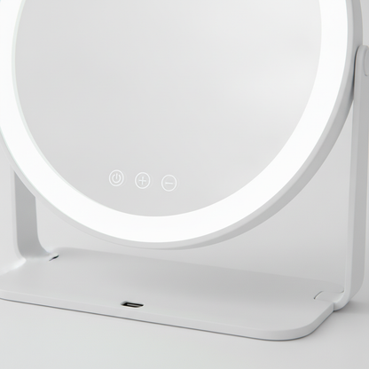Close-up of touch-screen dimming controls and LED light strip on vanity mirror